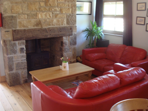 Log Burning Stove and sofas in our Tea Room - Come and enjoy a Breakfast, lunch or snack sat in front of our log burning stove.