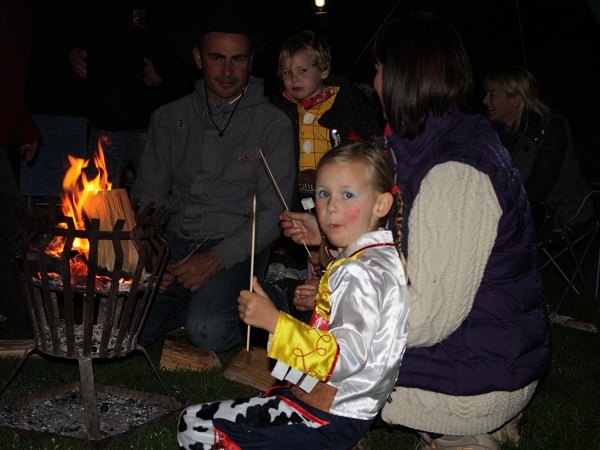 Eating Toasted Marshmallows Around the Campfire -