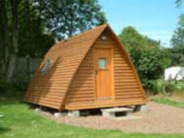 Cosy Timber Tent - Wigwam soaking up some sun at Machrihanish
