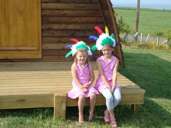 Two Little Indians - Enjoying the sun outside their wigwam